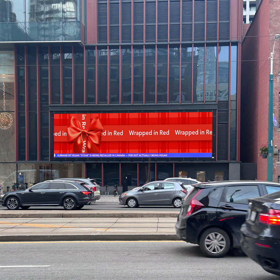 Rogers “Wrapped in red” digital billboard in Toronto, promoting holiday offers.