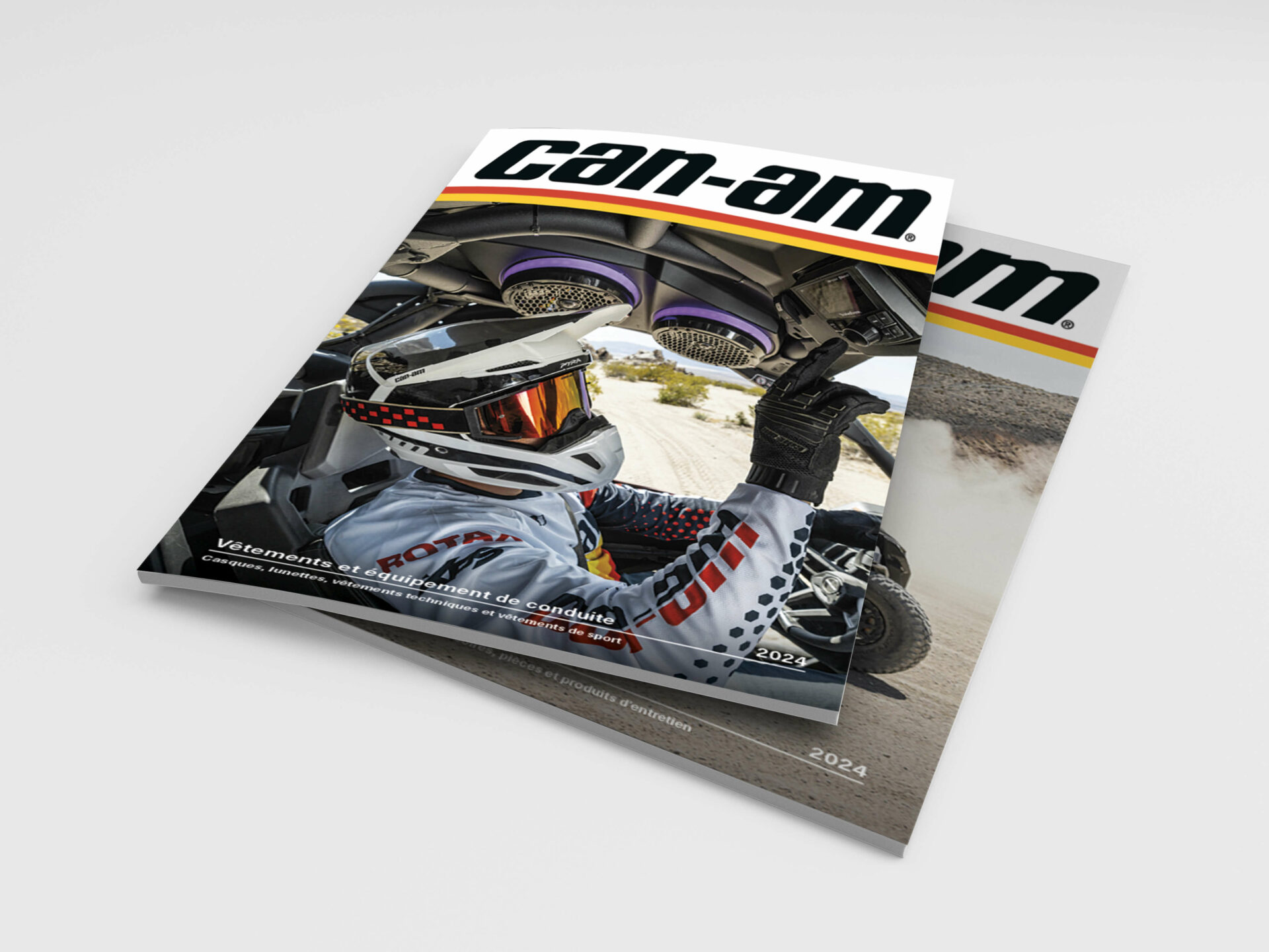 Couverture du catalogue imprimé Can-Am 2024 avec un conducteur casqué au volant d’un véhicule tout-terrain