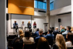 On-stage panel featuring Susan Krashinsky Robertson, Christina Litz, Jessica Gale, and Nuno Bamberg.