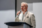 Photo of Christian Quenneville addressing the audience.